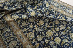 Surface texture of 2000s Kashan rug with natural Wool and intricate pattern