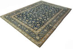 Corner detail of 2000s Kashan rug showing border pattern and Wool pile