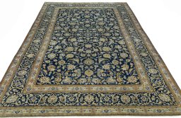 Surface texture of 2000s Kashan rug with natural Wool and intricate pattern