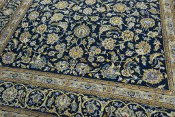 Close-up detail of 2000s Kashan rug from Iran / Persia showing Wool weave