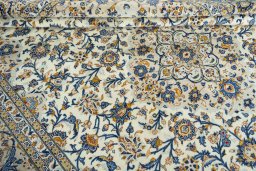 Close-up detail of 2000s Kashan rug from Iran / Persia showing Wool weave