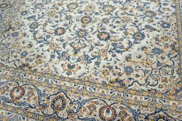 Close-up detail of 2000s Kashan rug from Iran / Persia showing Wool weave