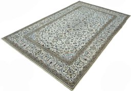 Corner detail of 2000s Kashan rug showing border pattern and Wool pile