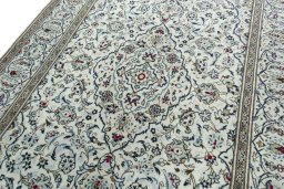 Backside of handmade 2000s Kashan rug showing knot structure and weave density