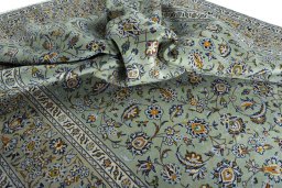 Surface texture of 2000s Kashan rug with natural Wool and intricate pattern