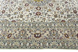 Corner detail of 2000s Kashan rug showing border pattern and Cork pile
