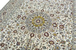 Backside of handmade 2000s Kashan rug showing knot structure and weave density