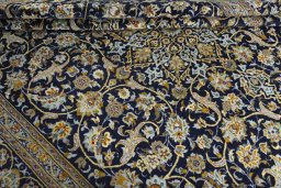 Close-up detail of 2000s Kashan rug from Iran / Persia showing Wool weave