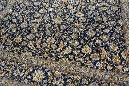 Close-up detail of 2000s Kashan rug from Iran / Persia showing Wool weave