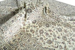 Surface texture of 2000s Kashan rug with natural Cork and intricate pattern