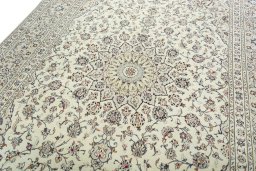 Backside of handmade 2000s Kashan rug showing knot structure and weave density
