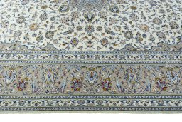 Corner detail of 2000s Kashan rug showing border pattern and Wool pile