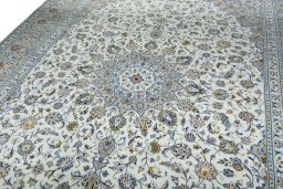 Backside of handmade 2000s Kashan rug showing knot structure and weave density
