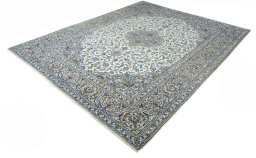 Corner detail of 2000s Kashan rug showing border pattern and Wool pile