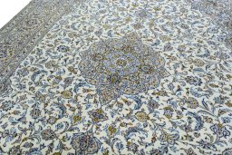 Backside of handmade 2000s Kashan rug showing knot structure and weave density