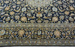 Corner detail of 2000s Kashan rug showing border pattern and Wool pile