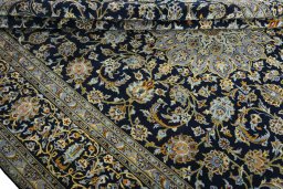 Close-up detail of 2000s Kashan rug from Iran / Persia showing Wool weave