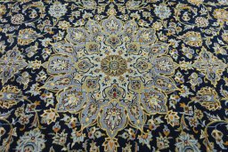 Central medallion detail of 2000s Kashan rug from Iran / Persia
