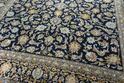 Close-up detail of 2000s Kashan rug from Iran / Persia showing Wool weave