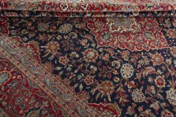 Close-up detail of 2000s Kashan rug from Iran / Persia showing Wool weave
