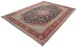 Corner detail of 2000s Kashan rug showing border pattern and Wool pile