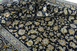 Close-up detail of 2000s Kashan rug from Iran / Persia showing Wool weave