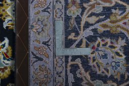 Surface texture of 2000s Kashan rug with natural Wool and intricate pattern