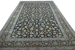 Surface texture of 2000s Kashan rug with natural Wool and intricate pattern