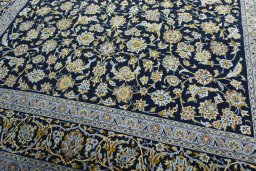 Close-up detail of 2000s Kashan rug from Iran / Persia showing Wool weave