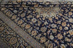 Close-up detail of 2000s Kashan rug from Iran / Persia showing Wool weave