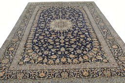 Surface texture of 2000s Kashan rug with natural Wool and intricate pattern