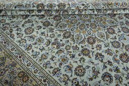 Close-up detail of 2000s Kashan rug from Iran / Persia showing Wool weave