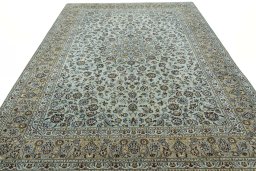 Surface texture of 2000s Kashan rug with natural Wool and intricate pattern