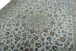 Backside of handmade 2000s Kashan rug showing knot structure and weave density