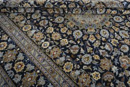 Close-up detail of 2000s Kashan rug from Iran / Persia showing Wool weave