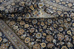 Surface texture of 2000s Kashan rug with natural Wool and intricate pattern
