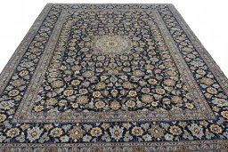 Surface texture of 2000s Kashan rug with natural Wool and intricate pattern