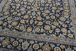 Close-up detail of 2000s Kashan rug from Iran / Persia showing Wool weave