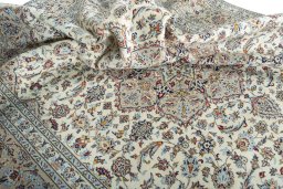Surface texture of 2000s Kashan rug with natural Wool and intricate pattern