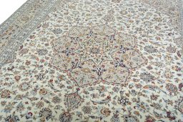 Backside of handmade 2000s Kashan rug showing knot structure and weave density