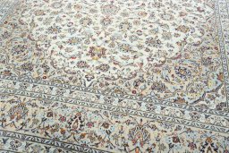 Close-up detail of 2000s Kashan rug from Iran / Persia showing Wool weave