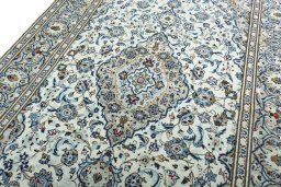 Backside of handmade 2000s Kashan rug showing knot structure and weave density