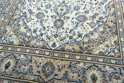Close-up detail of 2000s Kashan rug from Iran / Persia showing Wool weave