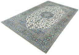Corner detail of 2000s Kashan rug showing border pattern and Wool pile