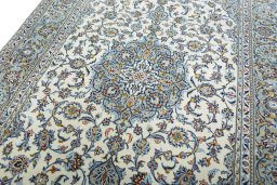 Backside of handmade 2000s Kashan rug showing knot structure and weave density