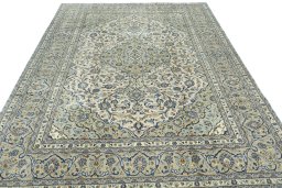 Surface texture of 2000s Kashan rug with natural Wool and intricate pattern