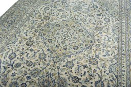 Backside of handmade 2000s Kashan rug showing knot structure and weave density