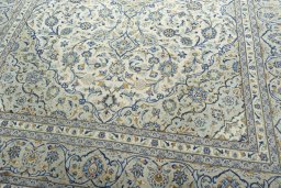 Close-up detail of 2000s Kashan rug from Iran / Persia showing Wool weave