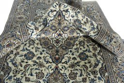 Surface texture of 2000s Kashan rug with natural Wool and intricate pattern