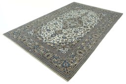 Corner detail of 2000s Kashan rug showing border pattern and Wool pile